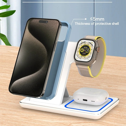 Wireless charging stand with smartphone, smartwatch, and wireless earbuds on a wooden surface.